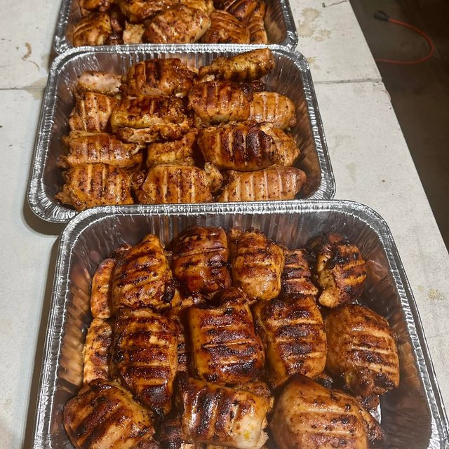 Trays of smoked ribs and burnt ends