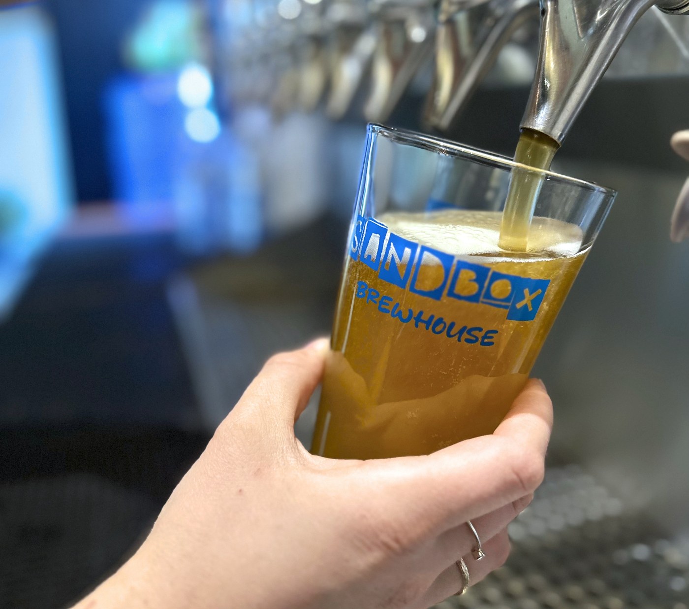A Sandbox Brewhouse glass being filled at the taps