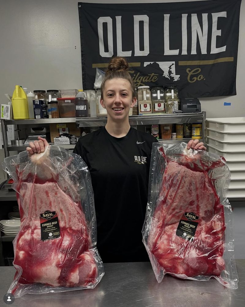The Old Line Tailgate Co. crew serving under the OLD LINE banner at a Frederick market