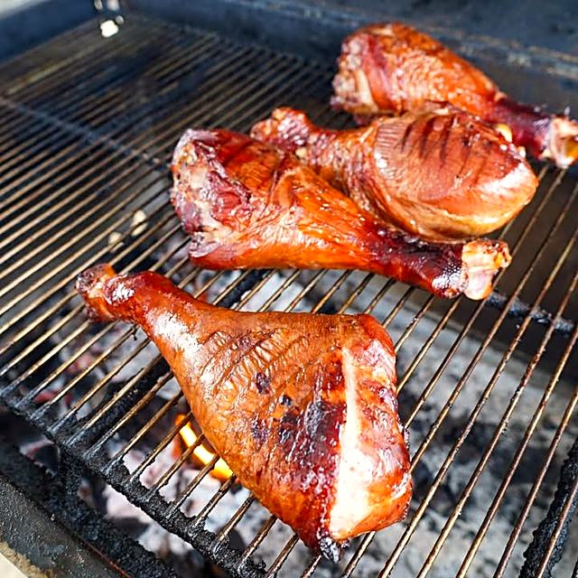 Glazed smoked turkey legs on the grate