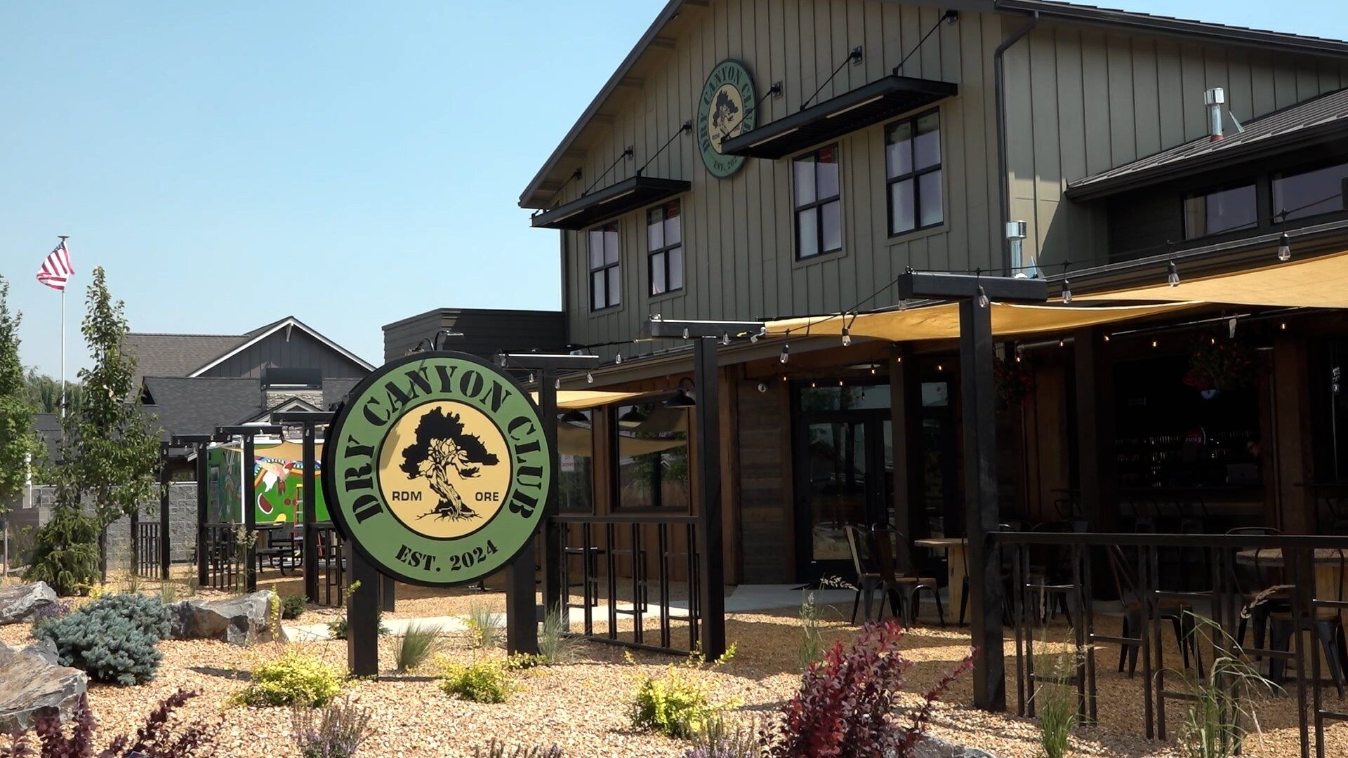 The Dry Canyon Club building and patio in Redmond, Oregon